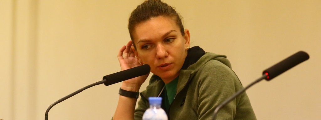 Simona Halep withdraws citing back injury